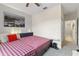 Bright bedroom with a king-size bed and an ensuite bathroom at 12420 Turtle Grass Dr, Orlando, FL 32824