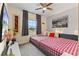 Spacious bedroom with a large window and a comfortable bed at 12420 Turtle Grass Dr, Orlando, FL 32824