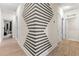 Unique hallway with geometric accent wall at 12420 Turtle Grass Dr, Orlando, FL 32824