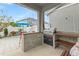 Outdoor patio with built-in grill, seating area, and string lights at 12420 Turtle Grass Dr, Orlando, FL 32824