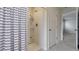 Bathroom with shower and striped shower curtain at 1245 Limbali St, Mount Dora, FL 32757