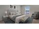 Spacious bedroom with plush bed and seating area at 1245 Limbali St, Mount Dora, FL 32757