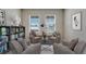 Charming library with built-in shelving and comfortable armchairs at 1245 Limbali St, Mount Dora, FL 32757