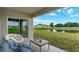 Peaceful patio overlooking a pond, perfect for relaxing at 1245 Limbali St, Mount Dora, FL 32757