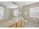 Bathroom with tub, shower, sink, and toilet at 128 Higher Combe Dr, Davenport, FL 33897