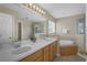 Double vanity, soaking tub, and separate shower at 128 Higher Combe Dr, Davenport, FL 33897