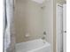 Clean bathroom with tub and shower at 128 Higher Combe Dr, Davenport, FL 33897