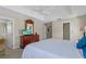 King-size bed, dresser, TV, ensuite bathroom access at 128 Higher Combe Dr, Davenport, FL 33897