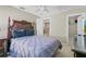 Bedroom with a queen-size bed and access to a walk-in closet at 128 Higher Combe Dr, Davenport, FL 33897