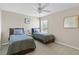 Bedroom with two twin beds, nightstands and ceiling fan at 128 Higher Combe Dr, Davenport, FL 33897