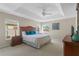 Spacious bedroom with king-size bed and large windows at 128 Higher Combe Dr, Davenport, FL 33897