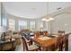 Open concept dining room with adjacent living room and kitchen at 128 Higher Combe Dr, Davenport, FL 33897