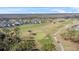 Aerial view of a neighborhood near a golf course at 128 Higher Combe Dr, Davenport, FL 33897