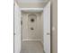 Small hallway with decorative wall niche at 128 Higher Combe Dr, Davenport, FL 33897