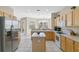 Spacious kitchen featuring stainless steel appliances and an island at 128 Higher Combe Dr, Davenport, FL 33897