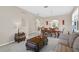 Living room with neutral decor, comfortable seating and coffee table at 128 Higher Combe Dr, Davenport, FL 33897