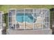 Screened-in pool with lounge chairs at 128 Higher Combe Dr, Davenport, FL 33897