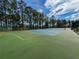 Enjoy a sunny day playing tennis on this well-maintained outdoor court at 128 Higher Combe Dr, Davenport, FL 33897