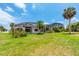 Large backyard, providing ample space for outdoor fun at 1748 Golfview Dr, Kissimmee, FL 34746
