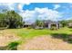 Spacious backyard with lush landscaping and pool at 1748 Golfview Dr, Kissimmee, FL 34746