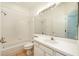 Bathroom with shower/tub combo and vanity at 1748 Golfview Dr, Kissimmee, FL 34746