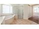 Bathroom features a large bathtub and shower at 1748 Golfview Dr, Kissimmee, FL 34746