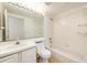 Clean bathroom with tub, toilet and vanity at 1748 Golfview Dr, Kissimmee, FL 34746