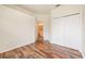 Bedroom with wood-look flooring and en-suite bath at 1748 Golfview Dr, Kissimmee, FL 34746