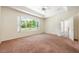 Bedroom with carpet floors and view of the backyard at 1748 Golfview Dr, Kissimmee, FL 34746