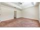 Spacious bedroom with carpet floors and double doors to closet at 1748 Golfview Dr, Kissimmee, FL 34746