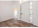 Bright entryway with tile flooring and stained glass at 1748 Golfview Dr, Kissimmee, FL 34746