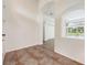 Entryway with tile floor and view to living room and pool at 1748 Golfview Dr, Kissimmee, FL 34746