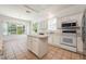 Kitchen with island and view to backyard and pool at 1748 Golfview Dr, Kissimmee, FL 34746