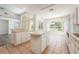 Kitchen with island, breakfast nook and view to the pool at 1748 Golfview Dr, Kissimmee, FL 34746
