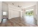 Open living area with tile floors and pool view at 1748 Golfview Dr, Kissimmee, FL 34746
