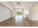Open living room with tile floors and access to backyard at 1748 Golfview Dr, Kissimmee, FL 34746