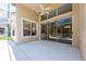 Covered patio with sliding glass doors leading to pool at 1748 Golfview Dr, Kissimmee, FL 34746