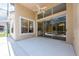 Covered patio with sliding glass doors leading inside at 1748 Golfview Dr, Kissimmee, FL 34746