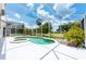 Relaxing screened pool and spa with ample deck space at 1748 Golfview Dr, Kissimmee, FL 34746