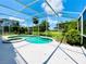 Screened pool and spa with a spacious deck at 1748 Golfview Dr, Kissimmee, FL 34746