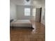 Spacious bedroom with tiled floors and window coverings at 2761 L B Mcleod Rd # C, Orlando, FL 32805