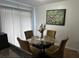 Dining room with four chairs and a glass-top table at 2761 L B Mcleod Rd # C, Orlando, FL 32805
