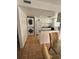 Kitchen with white cabinets, granite countertops, and a stackable washer/dryer at 2761 L B Mcleod Rd # C, Orlando, FL 32805