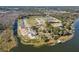Aerial view of homes and community by the lake at 3019 Tackle Dr, Leesburg, FL 34748