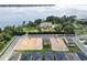 Aerial view of a lakefront community with new homes under construction at 3019 Tackle Dr, Leesburg, FL 34748