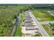 Aerial view of a row of houses near a canal at 3019 Tackle Dr, Leesburg, FL 34748