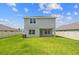 Newly constructed home with a grassy backyard and privacy fence at 3019 Tackle Dr, Leesburg, FL 34748