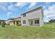 Private backyard with patio and grassy area at 3019 Tackle Dr, Leesburg, FL 34748