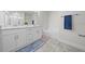 Main bathroom with double vanity and soaking tub at 3019 Tackle Dr, Leesburg, FL 34748