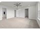 Bright bedroom with carpet flooring, neutral walls, and a large closet at 3019 Tackle Dr, Leesburg, FL 34748